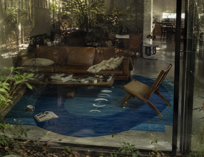 blue carpets on brown leather couch